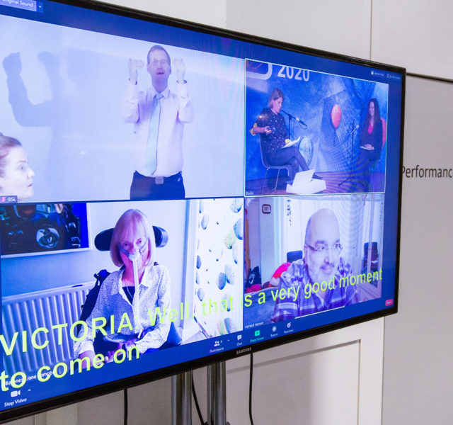 Focus on monitor broadcasting panel debate via Zoom