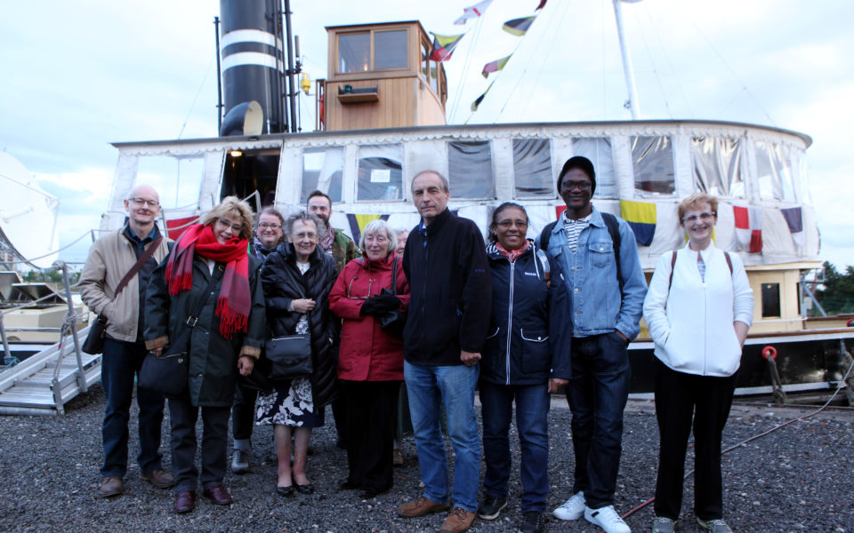 A group of people stood in front of the Danny Steam ship on Salford Quays
