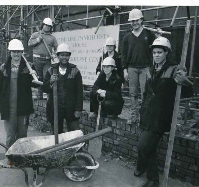 Photograph showing the women hired to work on the construction site of the Pankhurst Centre
