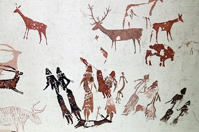 image of historic animals and people - like stone age