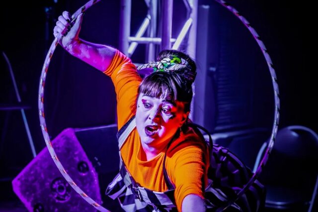 Danielle de la Wonk  using a hoola hoop