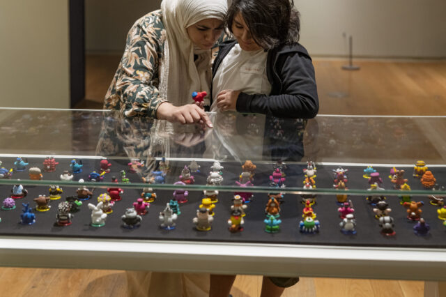 Family exploring the art collection in the gallery.