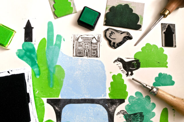 Image of art tools and foam birds and green paint.