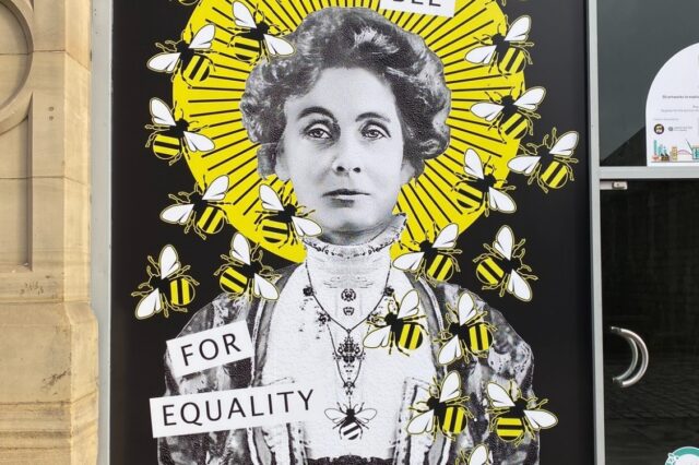 Image of Emily Pankhurst surrounds by the Manchester Bess with slogan Queen Bee for Equality