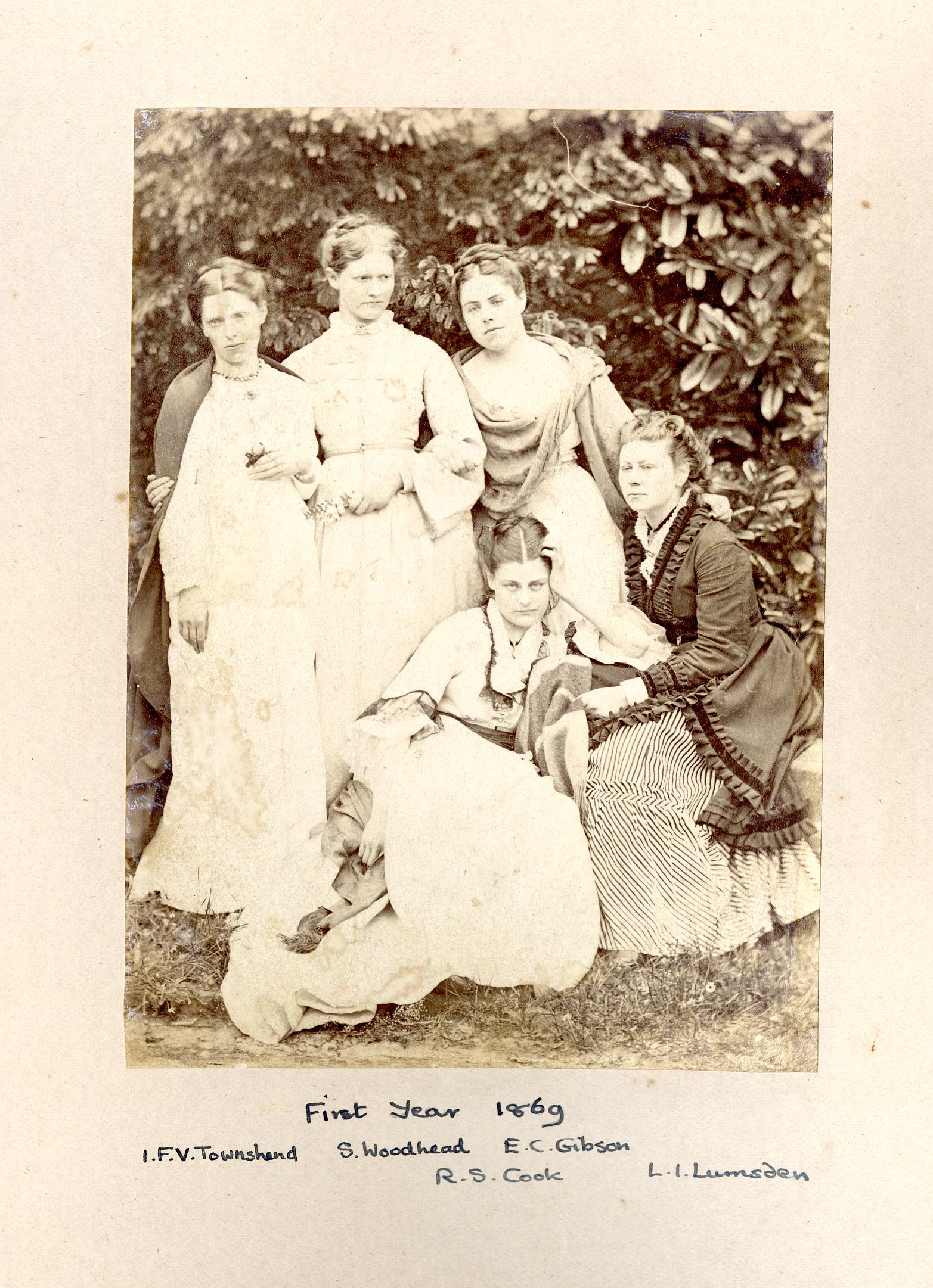 Sepia group photograph of five women who formed the first year of students at Hitchin College in 1869, including Rachel S. Cook, later Rachel Scott.