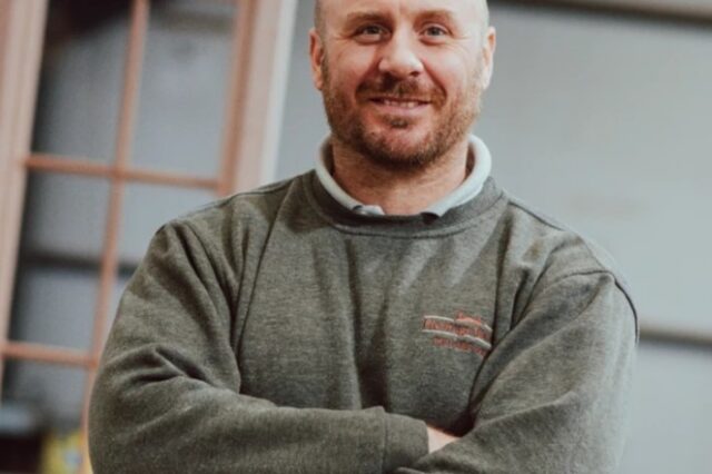 Headshot of Joe Buckley a white man with a beard